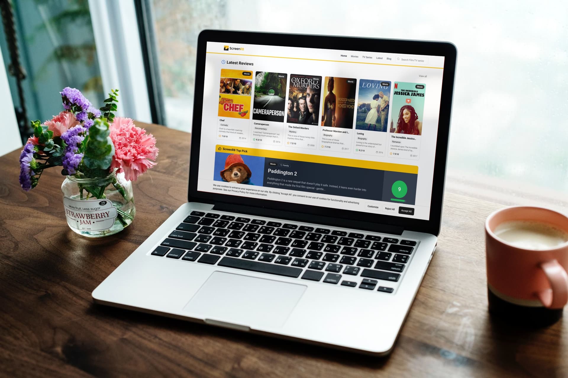 Web design workspace showing ScreenR8 website on laptop